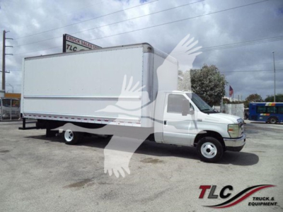 Ford E450 box truck with white cargo box and cab, side view, no visible text on box, parking lot background.