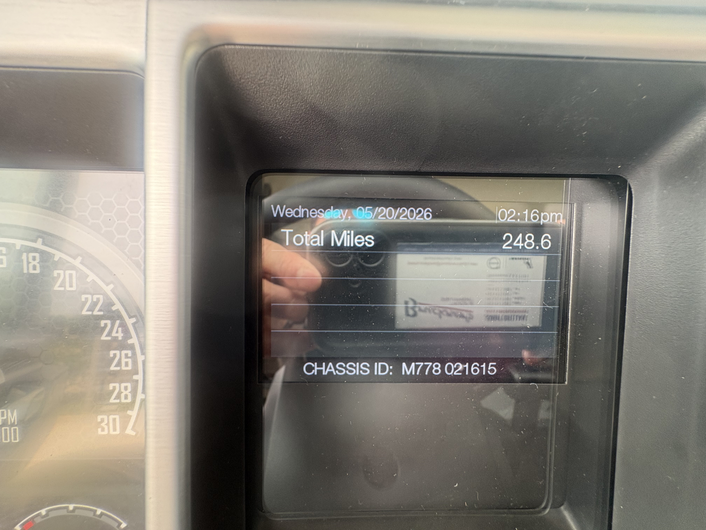 Mack PI64T truck dash display showing total miles 248.6 and date 05/20/2026 with chassis ID M778 021615 visible.
