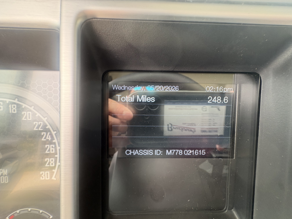 Mack PI64T truck dash display showing total miles 248.6 and date 05/20/2026 with chassis ID M778 021615 visible.