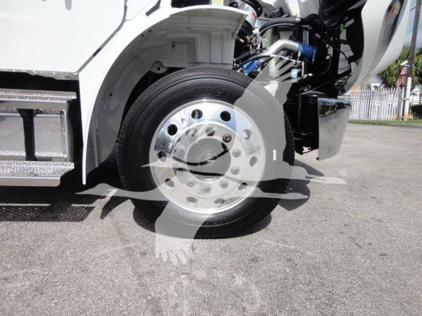 Freightliner Business Class M2 front wheel area showing wheel and part of chassis and hydraulic components.