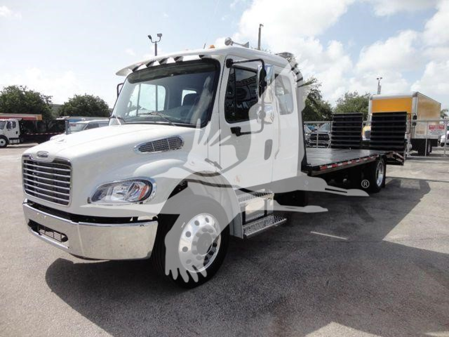 White FreightlinerBusiness Class M2 rollback truck with flatbed/hydraulic bed, cab front view, stock number overlay not visible.