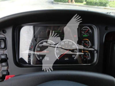 Dashboard view of a Freightliner Business Class M2 instrument cluster with speedometer, RPM gauge, and warning lights.