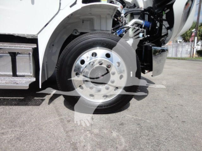 Freightliner Business Class M2 front wheel area showing wheel and part of chassis and hydraulic components.