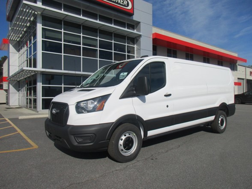 Ford Transit cargo van in a dealership lot showing exterior with blank side and front view.
