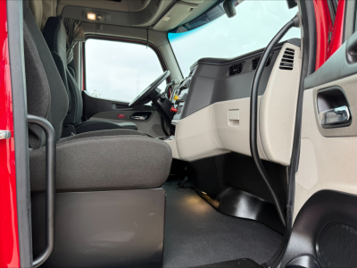 Peterbilt 579 truck interior cabin view showing driver seat and dashboard area.