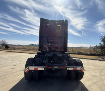 Rear view of a 2026 Mack PR64T76H truck tractor showing dual rear axles and fifth wheel with fuel tanks and trailer wiring harness visible.