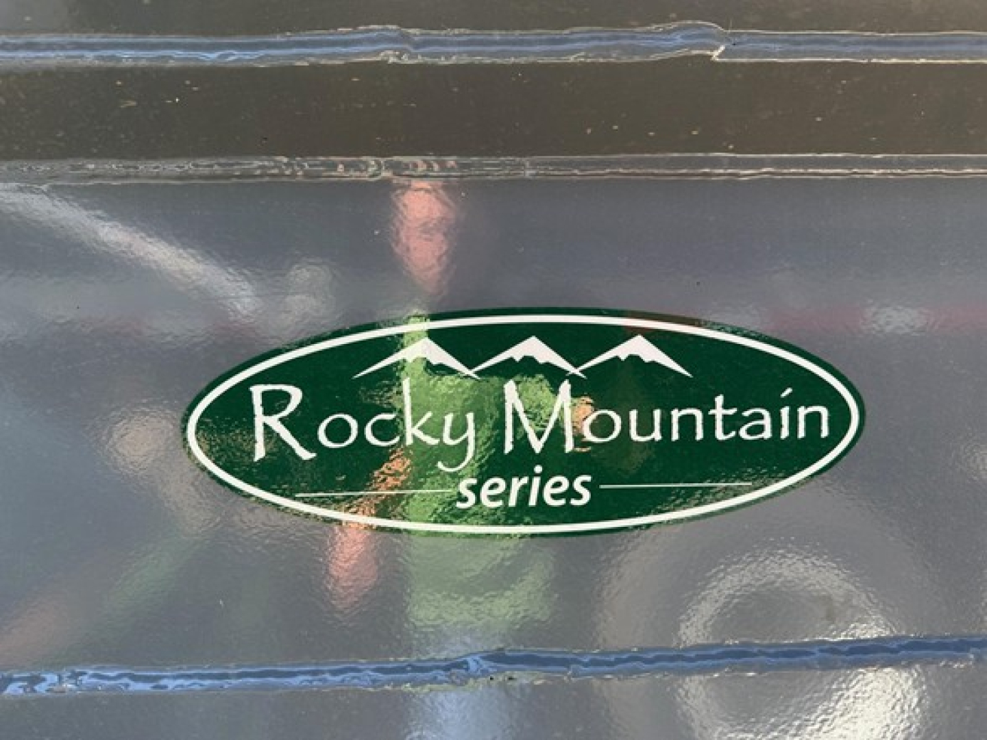 Rocky Mountain series logo decal on a dark trailer surface.