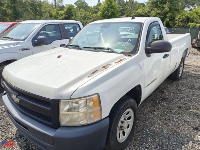 Chevrolet Silverado 1500 single-cab pickup in white with front-right view, showing hood damage and side mirrors; pickup bed visible in used condition.