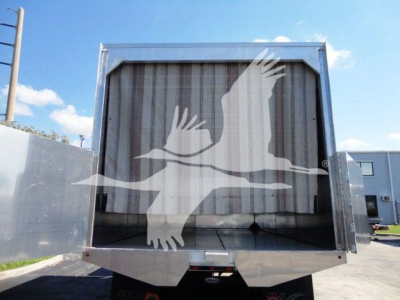 Image of a 2023 International MV truck chassis with a chipped rear cargo area and large grille opening visible.