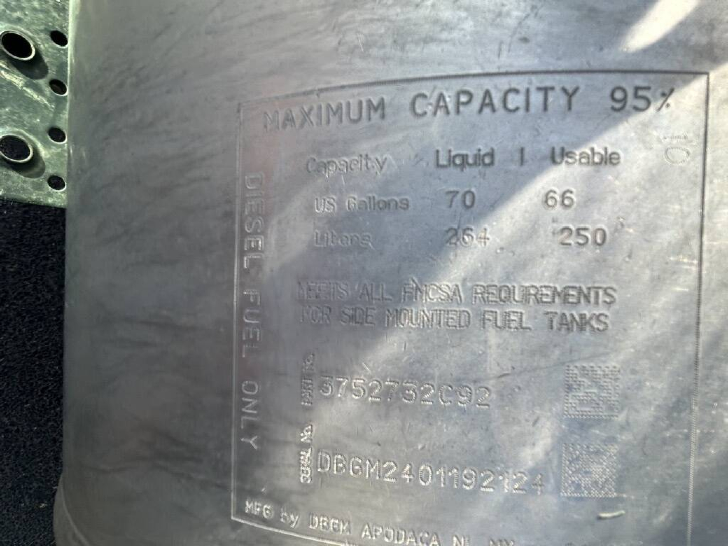 Diesel fuel tank label showing maximum capacity 95? with capacity 70 US gallons and 66 usable gallons, 250? Liable details; shows serial numbers and mounting notes.