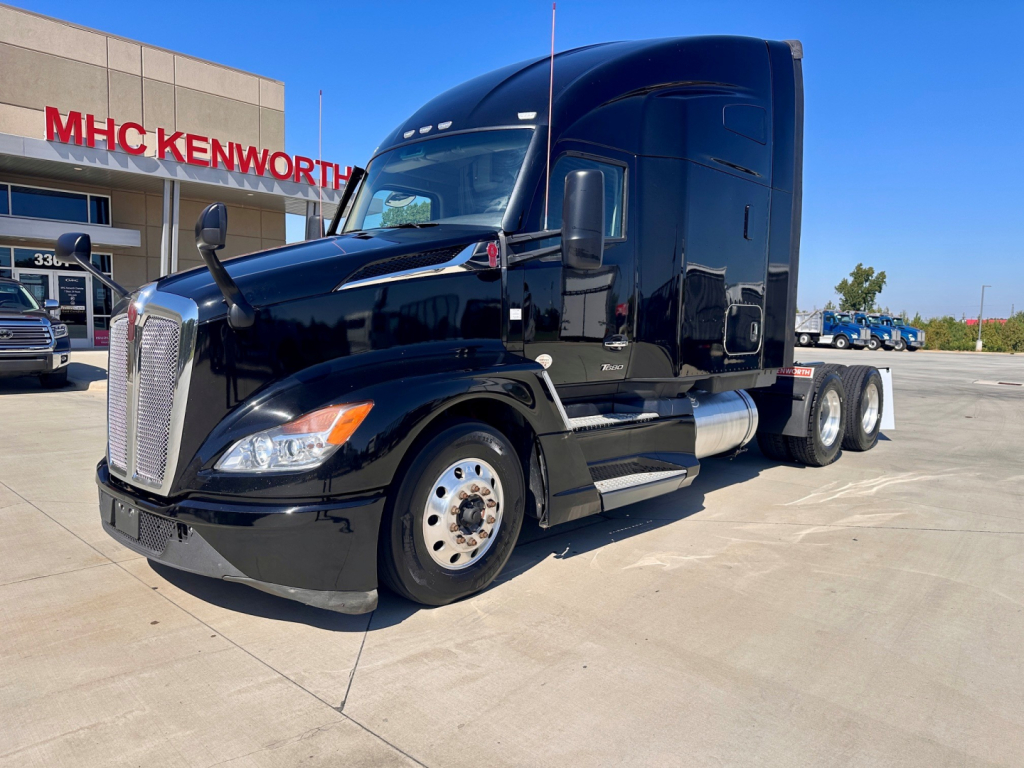 Kenworth T680 conventional sleeper tractor in black, front-left view, showing chrome grille, dual rear axles, and daytime running lights.