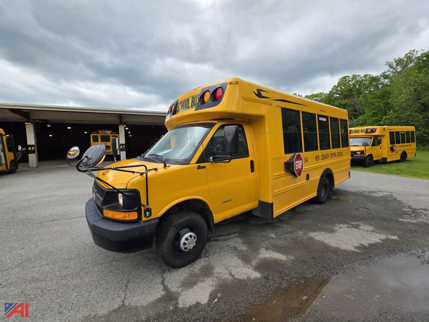 School bus 2014 Chevrolet Express G4500 in-service yellow exterior with front bumper, side emergency lights, and school bus signage visible.