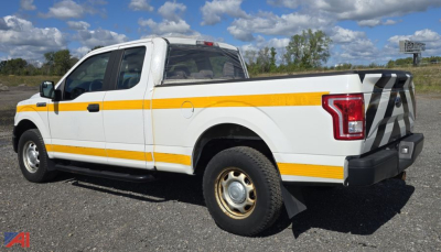 Ford F-150 pickup truck in service with white exterior and reflective yellow stripes, side view showing crew cab and long bed.