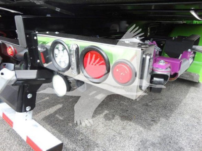Peterbilt 337 rollback truck rear bumper and taillight assembly showing LED round lights and chrome housing.
