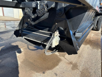 Ranco LW21-40 dump trailer hitch area showing electrical connector and hydraulic lines near the bottom corner.