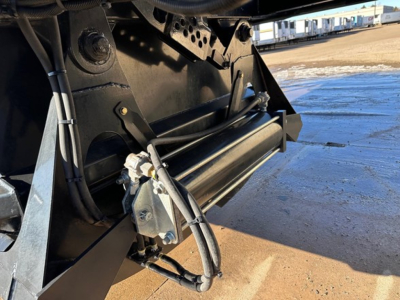 Ranco LW21-40 trailer component showing hydraulic line and roller undercarriage.