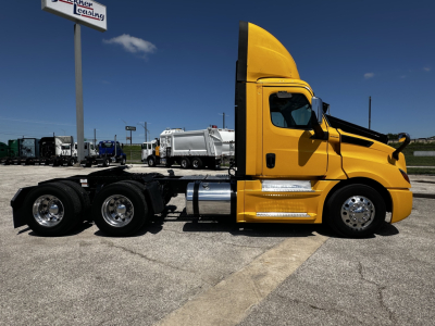 Freightliner Cascadia 126 daycab chassis side view with yellow cab and black frame showing exhaust stack and fuel tanks.