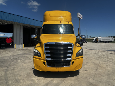 Front view of a yellow 2019 Freightliner Cascadia 126 daycab truck with chrome grille and black bumper.