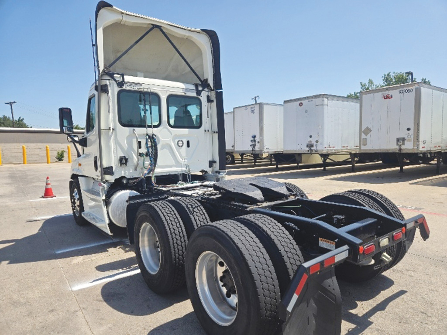 2019 Freightliner Cascadia125 Evolution tractor cab and rear chassis view showing dual rear axles and fifth wheel area
