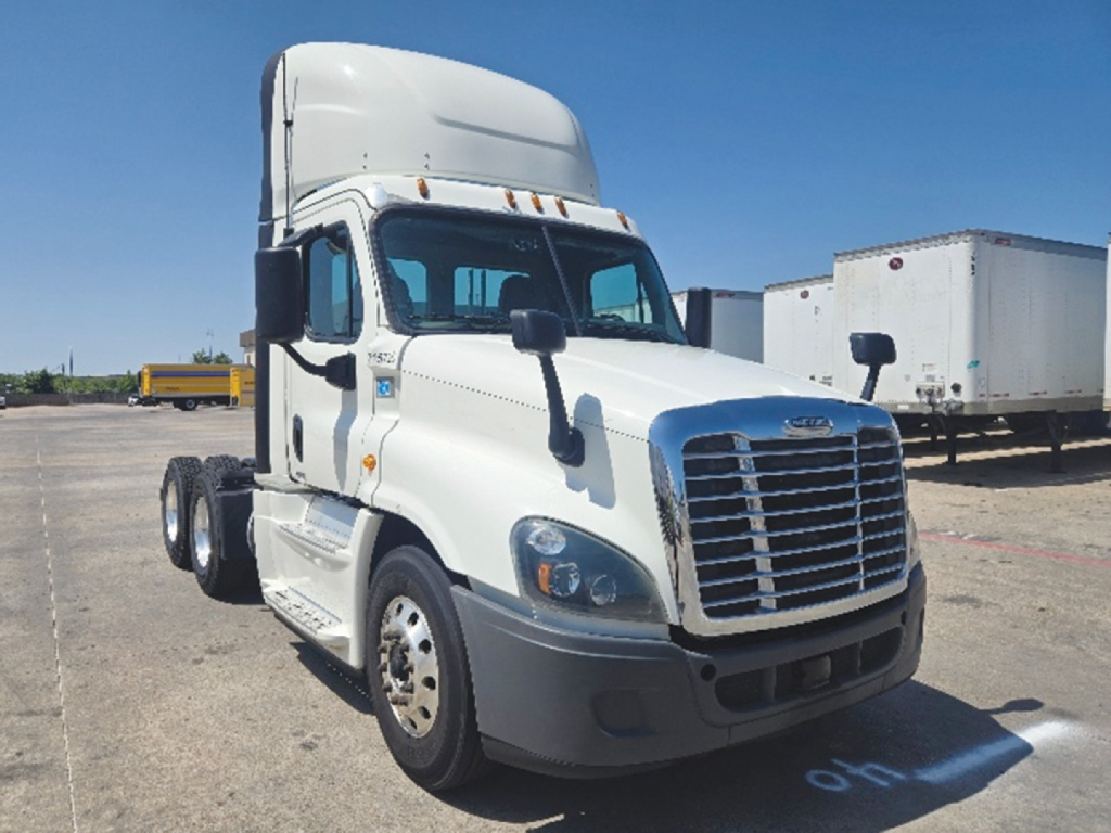 Truck engine bay front view of a white Freightliner Cascadia Evolution 125 cab tractor with front grille and side mirrors.
