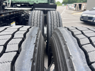 Truck rear dual tires on Volvo VNL configuration showing tread detail and wheel alignment.