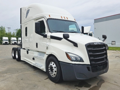 Freightliner Cascadia126 semi truck front three-quarter view with sleeper cab, white exterior, black grille, and dual rear axles.