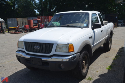 Ford Ranger pickup truck 2002 white extended cab 4x4 front-side view showing grille and bumper.