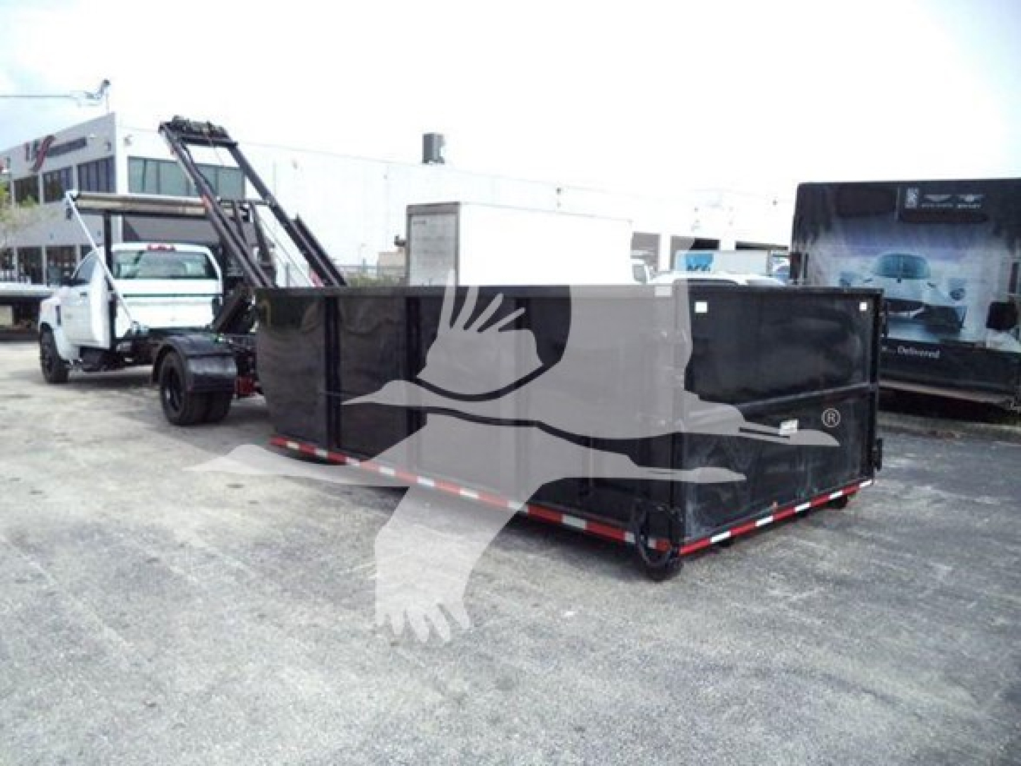 Truck equipment trailer in lot with writing on side, Silverado 6500HD appears in listing; no legible close-up text visible on image.