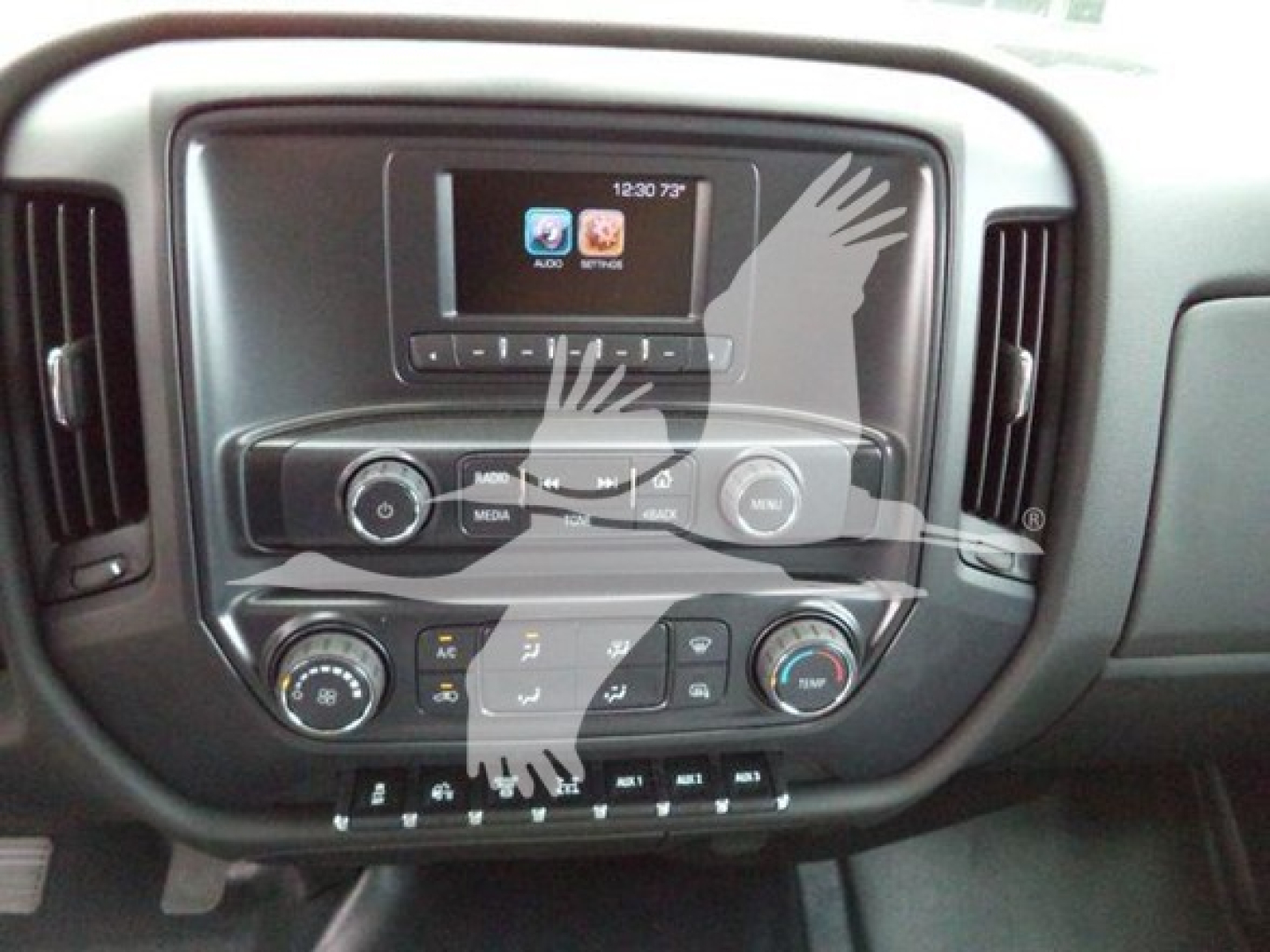 Chevrolet Silverado 6500hd dashboard interior showing touchscreen display and control buttons.