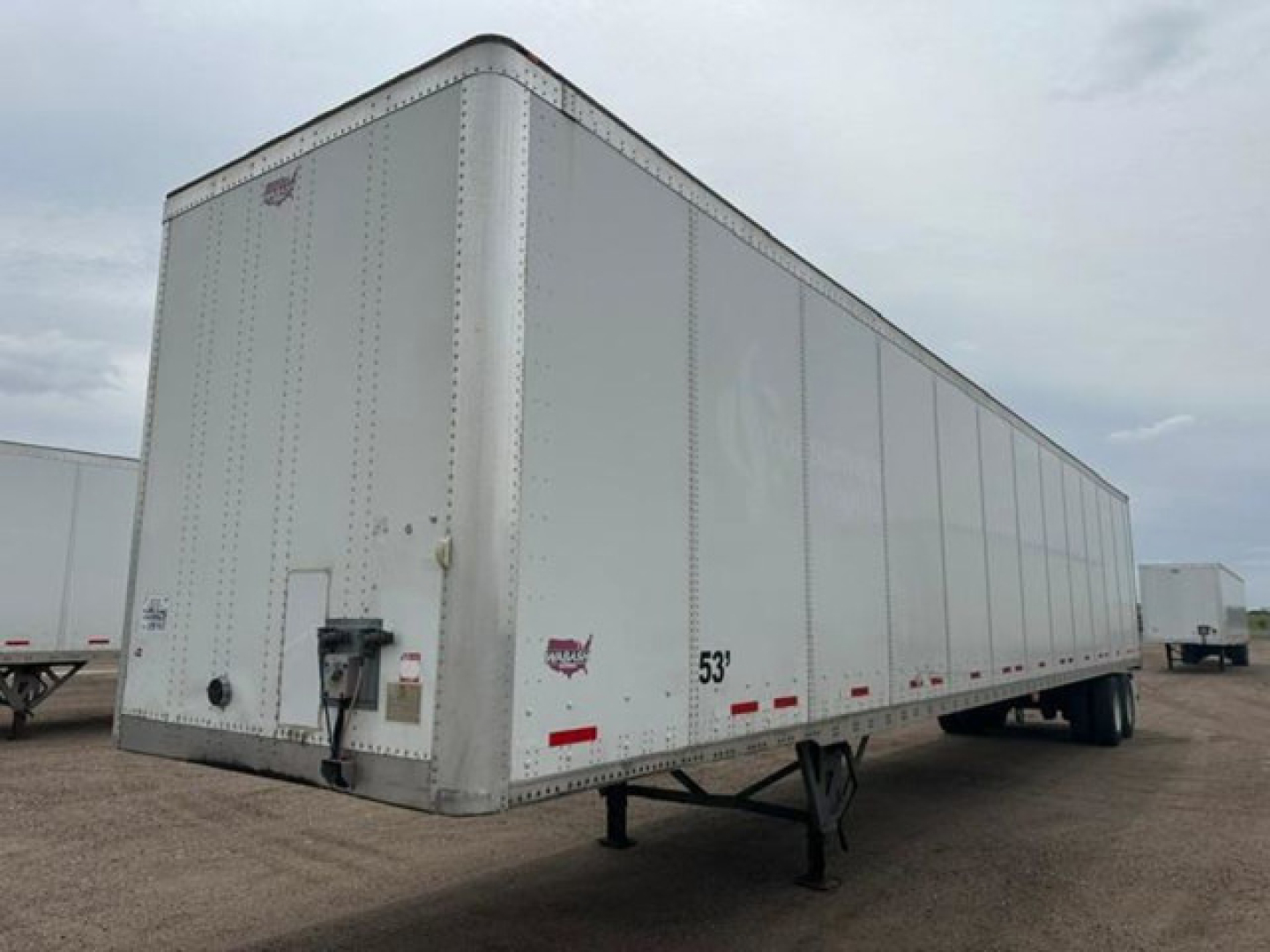 Trailer side view showing 53' Wabash van trailer with aluminum exterior and front hitch, VIN 1JJV532D6GL908638 visible.