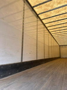 Interior of a Wabash trailer cargo area showing wood floor and side panels