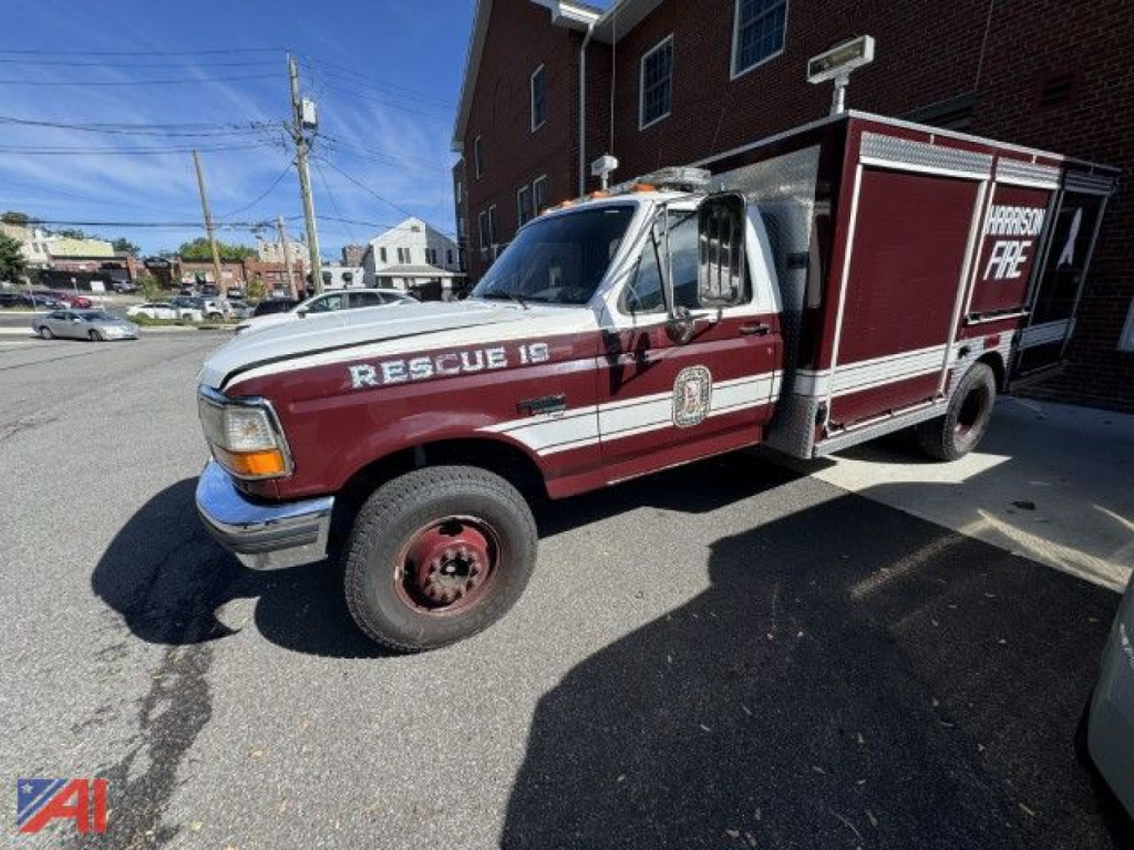 Ford F-Super Duty fire rescue truck from the side displaying RESCUE 19 and emergency markings.