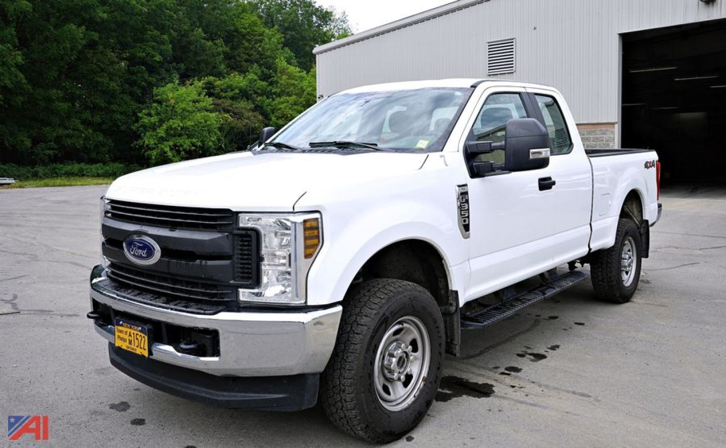 Ford F-350 Super Duty pickup truck single rear wheel, white, front three-quarter view, with extended cab, black grille, NY license plate.