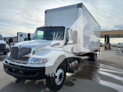 Truck engine bay? No. Box truck side view showing 2021 International MV with box trailer and cab white, stock T64863, VIN 3HAEUMML9ML864863.