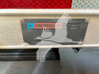Truncated Morgan Plate on rear of box truck showing serial/model plate with Morgank blue/black logo and date code.