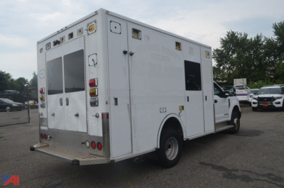 Ambulance box truck rear-right view showing exterior compartments and back doors