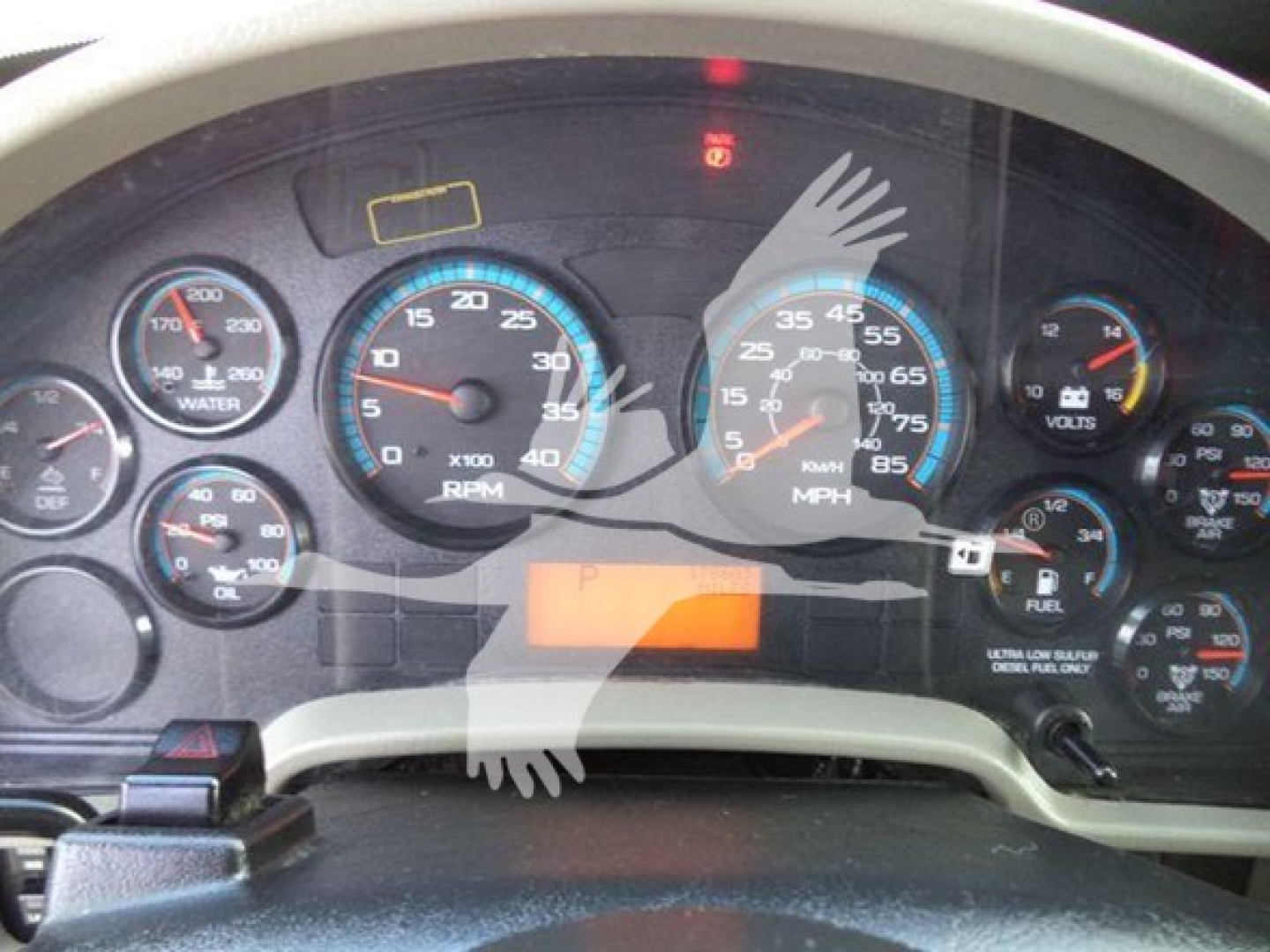 Dashboard view of a 2019 International Durastar 4300 showing multiple gauges including RPM, speed, fuel, voltage, and warning lights.