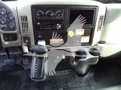 Dashboard view of a 2019 International Durastar 4300 cab with gear selector, control panels, and cup holders.