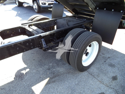Isuzu NPRR truck chassis showing dual rear wheels and frame near suspension.