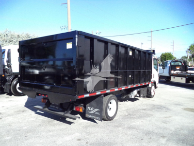 Isuzu NPRR dump truck bed side and rear showing solid black dump body with white bird graphic.