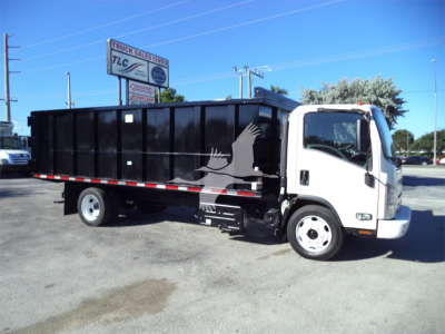 Isuzu NPRR dump truck side view showing black dump body and white cab.