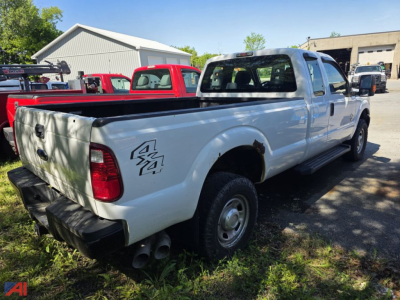 Ford F-350 Super Duty pickup truck in white, extended cab, with dual rear wheels showing tailgate and bed, side view, 4x4 badge on rear quarter panel.
