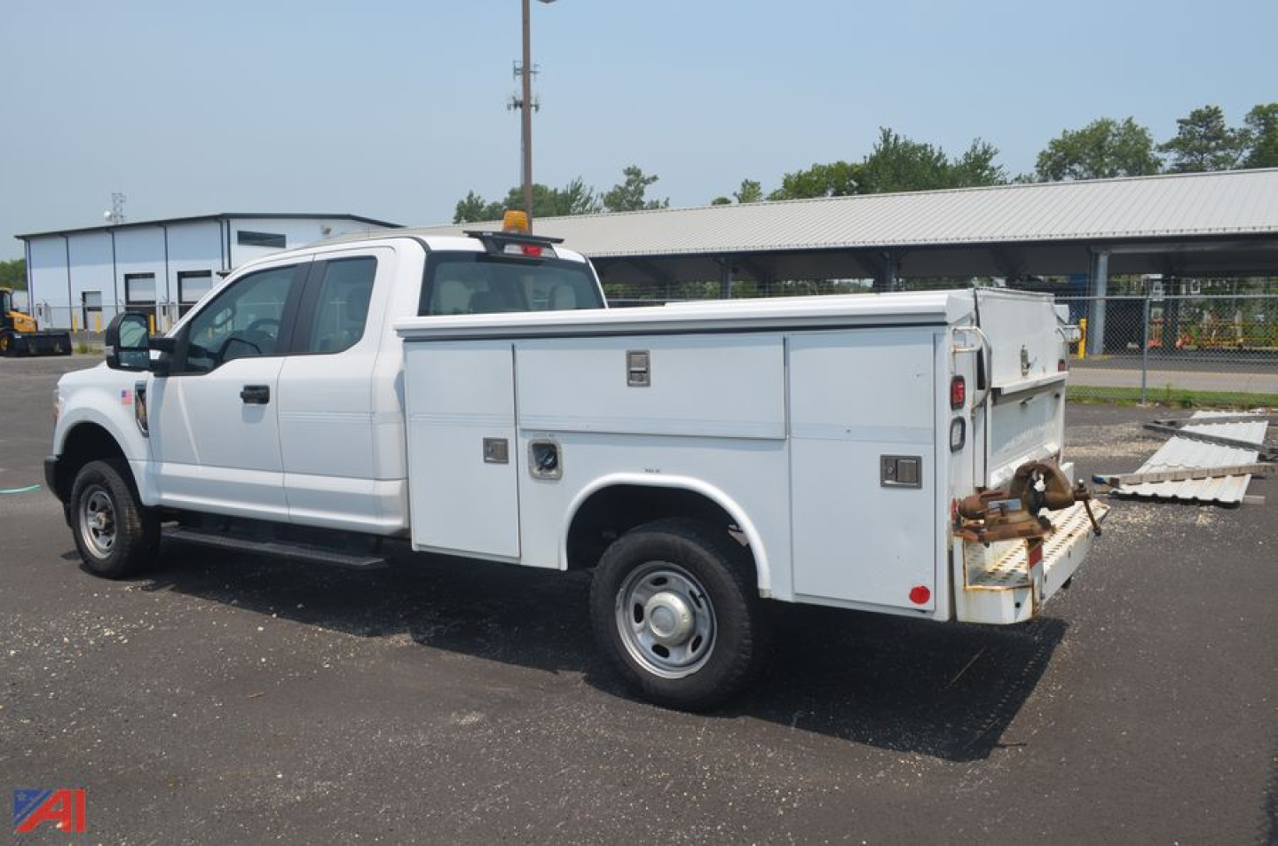 Ford F-250 Super Duty utility truck in service/utility category, extended cab with service body and compartments.