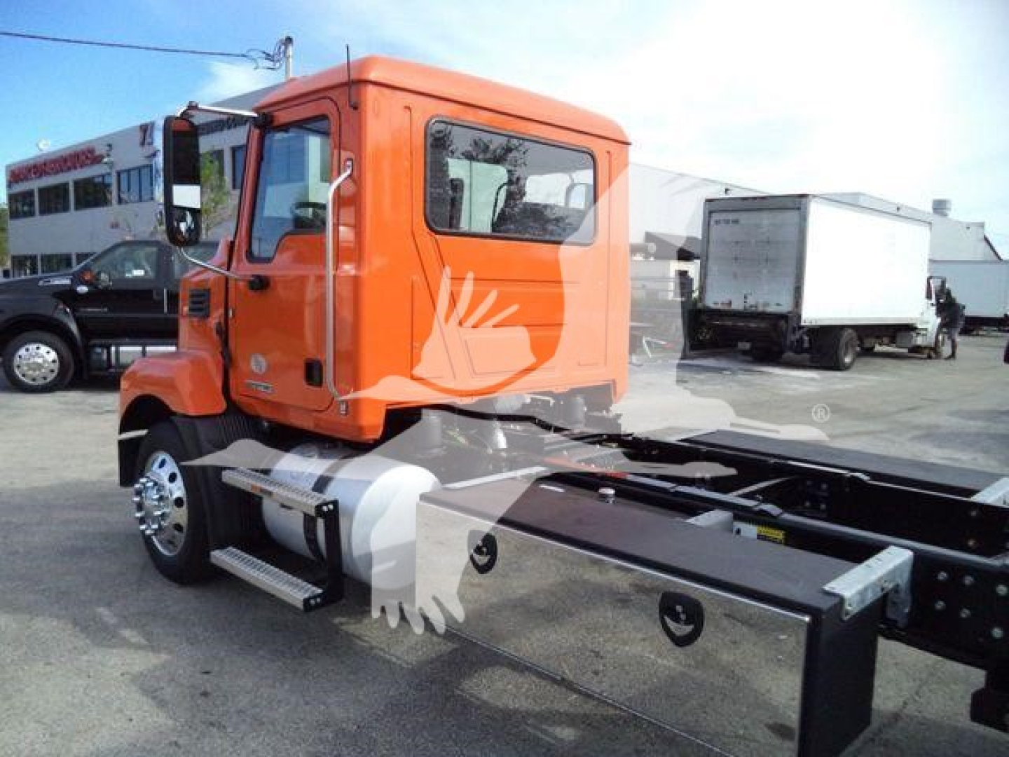 Orange 2026 Mack MD6 cab and chassis shown in side view, with empty bed frame and side step, stock number ORANGEMD6XLP22 visible.