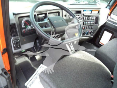 MD6 dashboard and steering wheel view inside cab showing instrument cluster and center control panel.