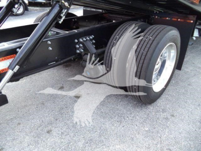 Mack MD6 truck chassis showing dual rear wheels and suspension components.