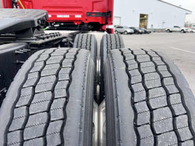 Volvo VNL64T300 truck dual rear wheels with tread detail showing tires and frame.