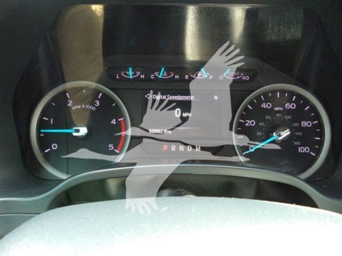 Dashboard view of a 2022 Ford F600 showing instrument cluster with speedometer and tachometer, digital display reading 0 mph, PRNDL gear indicator.