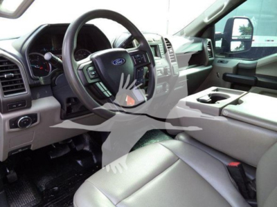 Ford F-600 truck interior showing steering wheel and dashboard from driver’s side.