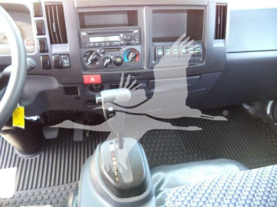 Isuzu NPRR dashboard and gear shifter showing center console and controls.